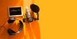 © ulza - Professional microphone with waveform and headphones on yellow background banner. Podcast or recording studio background