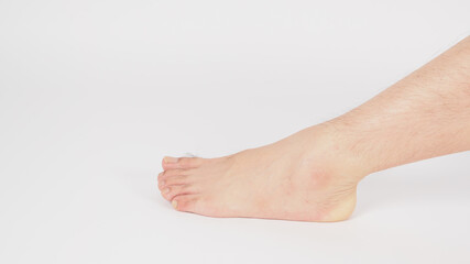 Wall Mural - barefoot and legs of Asian Male is isolated on white background.