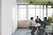 © xartproduction - Group of young business people working and communicating while sitting at the office desk together with colleagues sitting. business meeting
