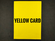 Selective Focus.Word Yellow CARD On Yellow Paper Card With Black Background.