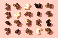 Chocolate Easter Eggs And Bunnies On Pink Background Pattern