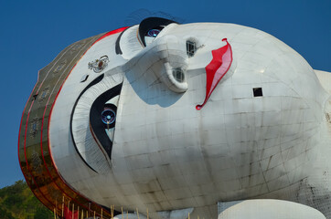 Sticker - Buddhist temple Win Sein Taw Ya in Myanmar - The face of the world's largest reclining Buddha