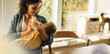 © Jacob Lund - Loving mother feeding baby son with bottle