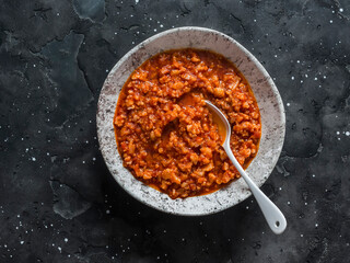 Wall Mural - Vegetarian cauliflower cabbage bolognese sauce on dark background, top view