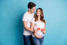 Photo Of Young Happy Lovely Cheerful Smiling Couple Family Look At Each Other Hold Heart Isolated On Blue Color Background