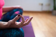 © oscar - woman wearing colorful clothes doing yoga workout at home