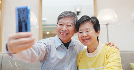 Wall Mural - elder couple take selfie