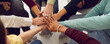 © Studio Romantic - People of different ages and nationalities fold their hands on each other, symbolizing their unity and support. Team of people who are set up for productive work and a positive result. Close up.