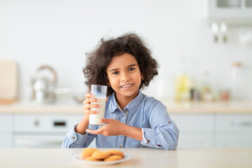 Wall Mural - Cute Little Afro Girl Drinking Milk From Glass