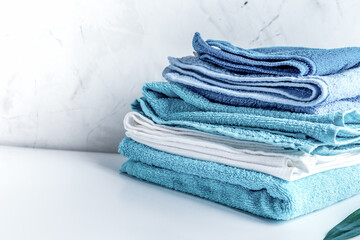 Towels pile in housekeeping set on laudry background mock up