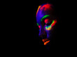 © Antipina - trendy neon makeup on the model. Woman with ultraviolet make-up. Disco night club chameleon. UV colors. Fashion of the future bright appearance. face Art. Copy space for text background