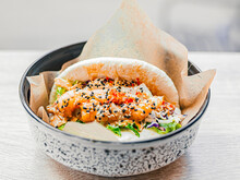 Bao With Shrimp In Paper In A Plate. Rice Buns With Vegetable, Seafood Filling With Sauce, Sprinkled With Sesame Seeds. Fast Food In A Cafe, Restaurant. Tasty Dish