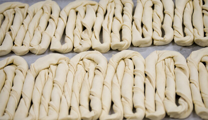 Sticker - Closeup shot of puff pastry designed as a twisted rope and put on a tracing paper