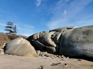 Sticker - Closeup shot of a seashore with big cracked rocks in Ula, Norway