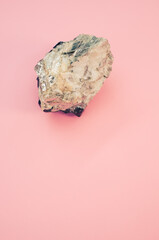 Sticker - Closeup shot of a mineral rock on a pink surface