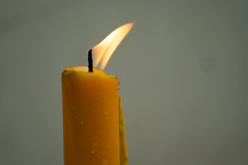 Photo of candle and candle flame to the right