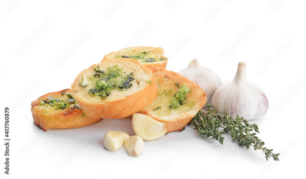 Slices of toasted bread with garlic on white background