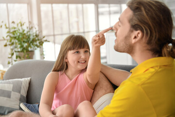 Wall Mural - Happy father and daughter at home