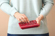 © Pixel-Shot - Woman with calculator, closeup view