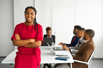 Wall Mural - team of young african people in the office at the table with a laptop 