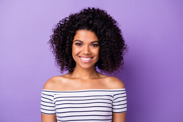 Sticker - Portrait of adorable cheerful dark skin lady toothy smile look camera isolated on purple color background