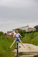 Sticker - Child, boy, riding bike in muddy puddle, summer time