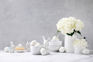 Wall Mural - Easter decorations such as porcelain bunnies and eggs on a kitchen countertop