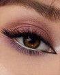 © svetlichniy_igor - Beautiful macro shot of female eye make-up in smoky eyes style. Purple. Creative make-up. Perfect shape make-up and long lashes. Cosmetics. Beautiful eyes makeup. Close-up