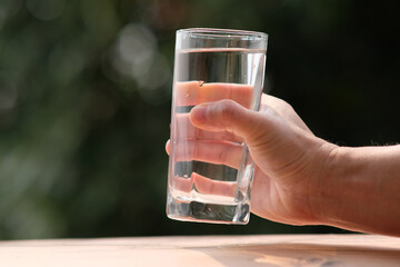 Canvas Print - pouring drinking water and health care concept