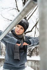 Wall Mural - Young athletic woman during her winter workout outside