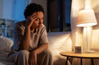 © Syda Productions - people, bedtime and rest concept - stressed african american woman having headache in bed at night