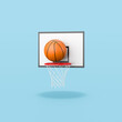 © MR - Basketball Ball Entering in the Basket on Blue Background