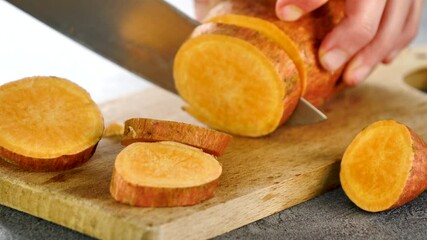 Poster - cutting raw sweet potato on board