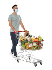 Sticker - Man with protective mask and shopping cart full of groceries on white background