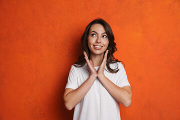 Sticker - Happy beautiful brunette girl gesturing and looking upward