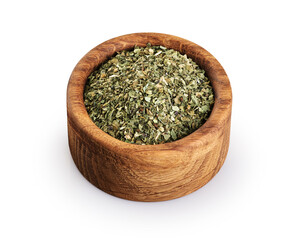 Wall Mural - Dried basil in wooden bowl isolated on white background.