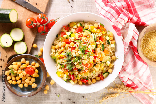bowl of vegetarian couscous and ingredients © M.studio