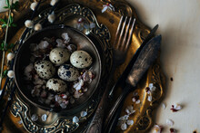 Vintage Or Rustic Easter Table Setting From Above. Plate, Cutlery, Eggs On And Natural Spring Branch On Rustic Wood. Country Style. Copy Space. Toned Image.