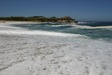 Carmel Beach, California With Aqua Blue Clear Water On The Beach And The Wave Retreating With White Ripples