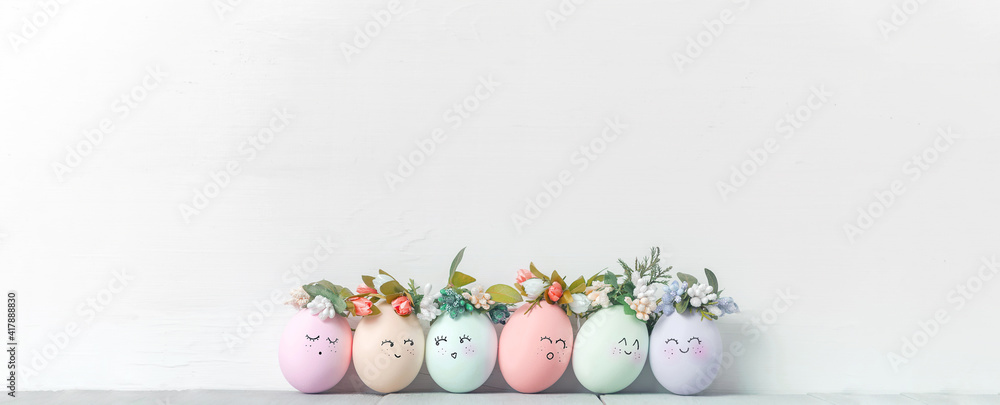 decorative easter eggs on a light wooden background. Easter-themed background with place for text - obrazy, fototapety, plakaty 