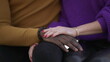 © Marco - Girlfriend hand caressing boyfriend. Interracial diverse couple, close-up hands