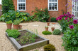 Landscaped courtyard garden with raised beds, UK