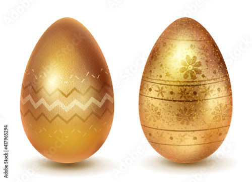 Two realistic Easter eggs with different surface texture, patterns and holiday symbols in golden colors. With shadows on white background © Olga Moonlight