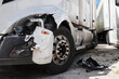 © Light name - Damage closeup on white truck.