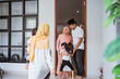 © Odua Images - excited asian muslim family visiting friend during eid fitri mubarak at home
