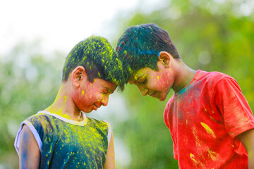 Cute indian little child playing holi. Holi is colors festival in india