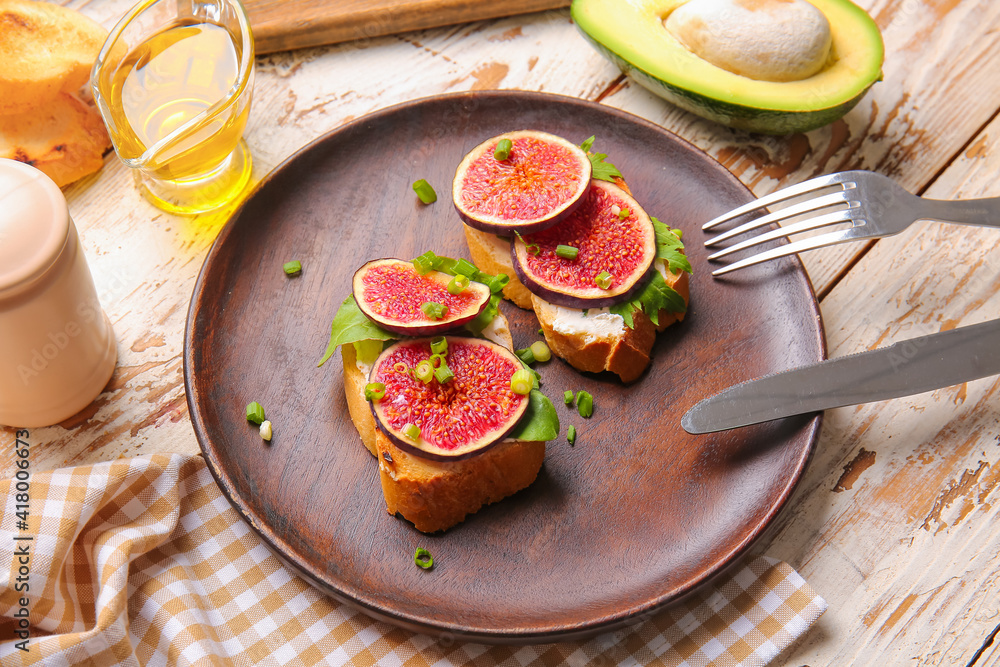 Plate with fresh tasty bruschettas on wooden background
