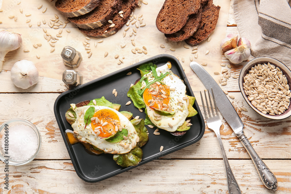 Tray with fresh tasty bruschettas on wooden background