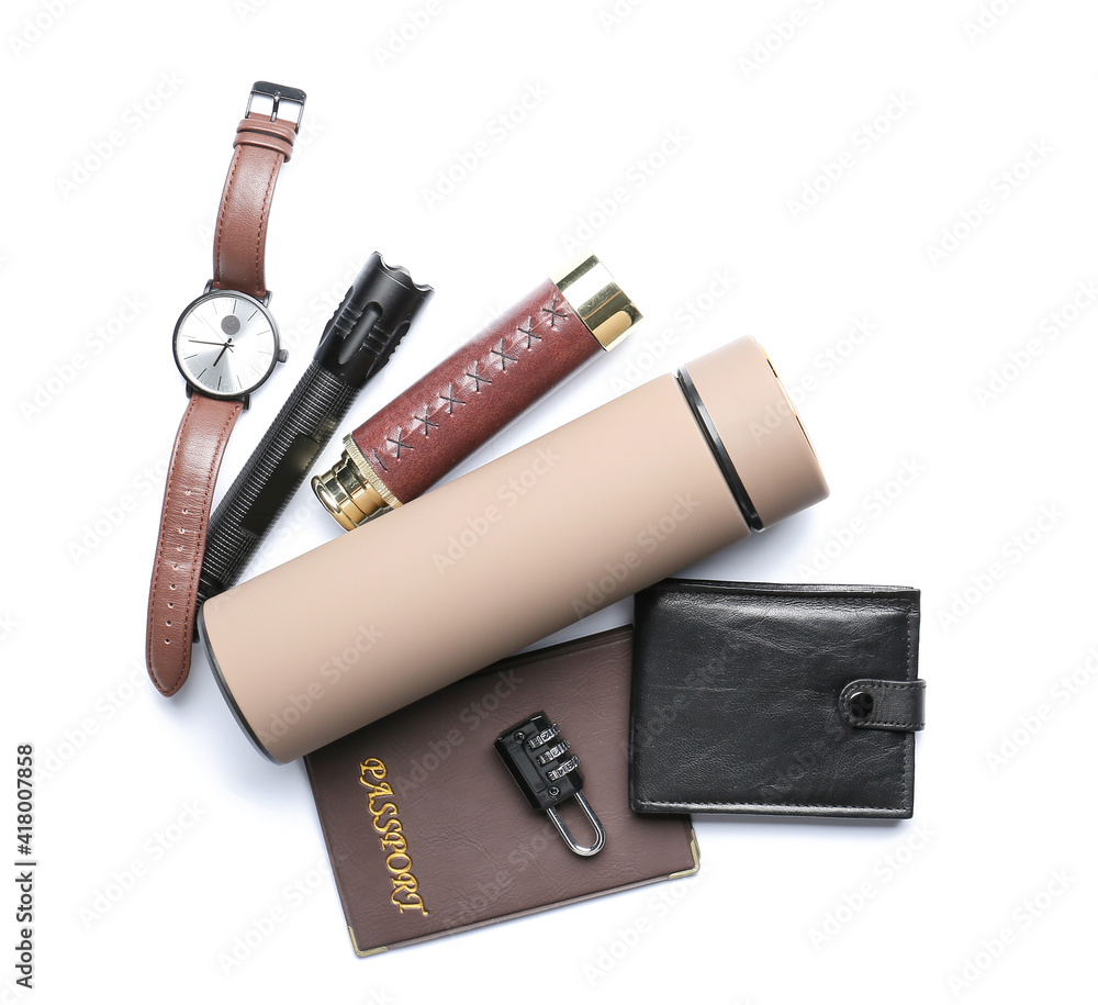 Modern thermos and items for travel on white background