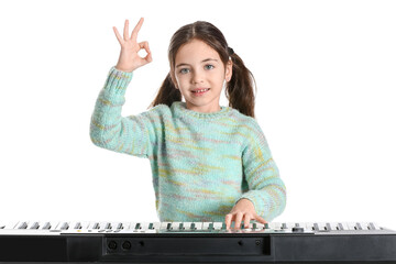 Wall Mural - Little girl playing synthesizer on white background